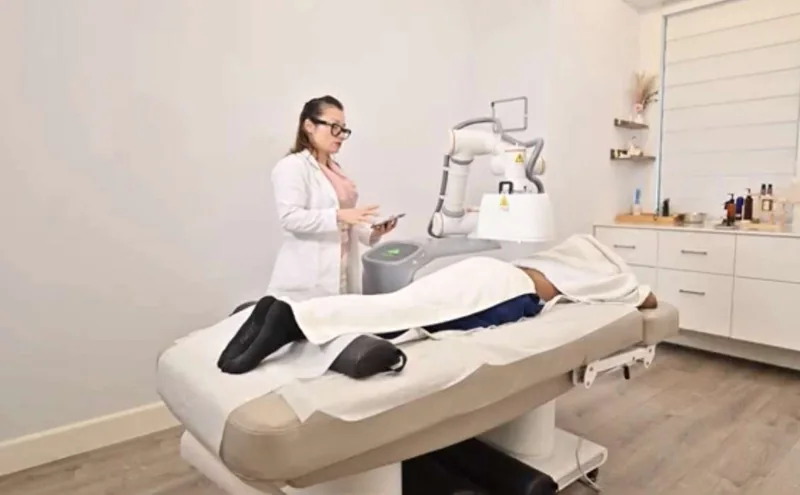 Warming treatment equipment beside a treatment table